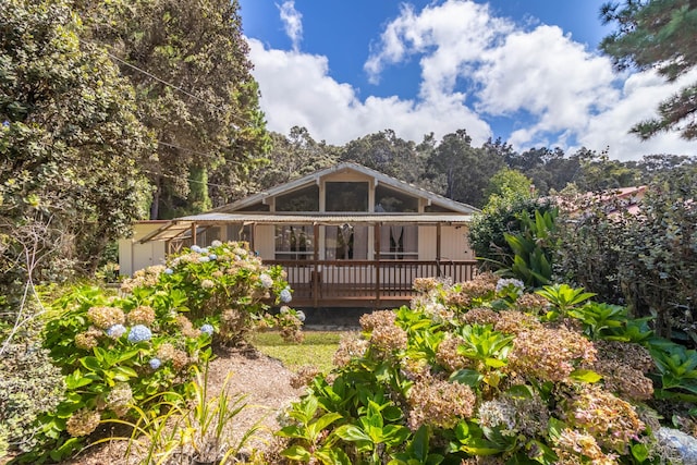 rear view of house with a wooden deck