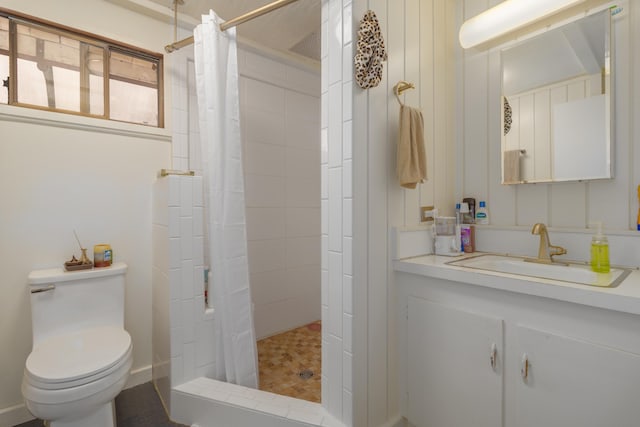 bathroom featuring vanity, toilet, and a shower with shower curtain