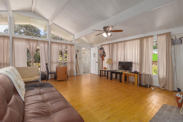 living room featuring ceiling fan, lofted ceiling with beams, and light hardwood / wood-style flooring