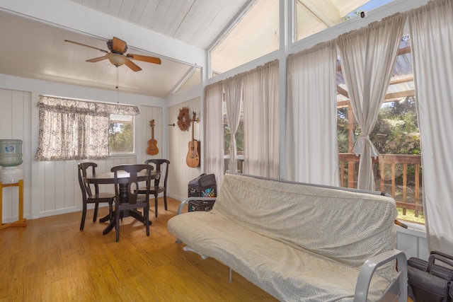 sunroom / solarium with lofted ceiling with beams and ceiling fan