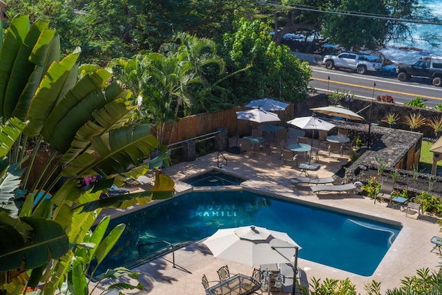 view of swimming pool with a patio