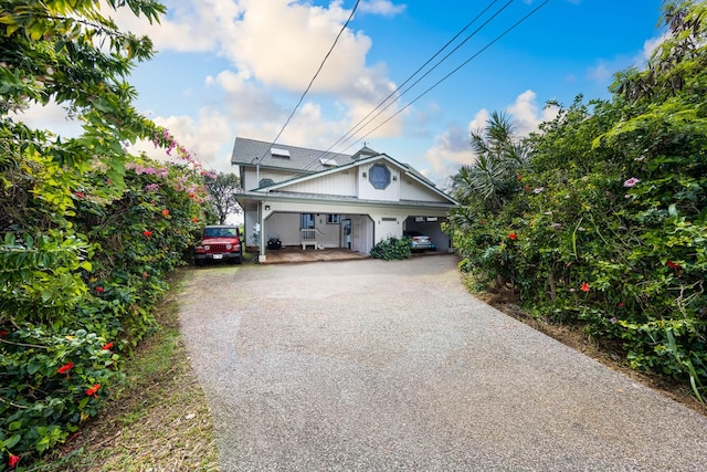 view of front of home with a carport