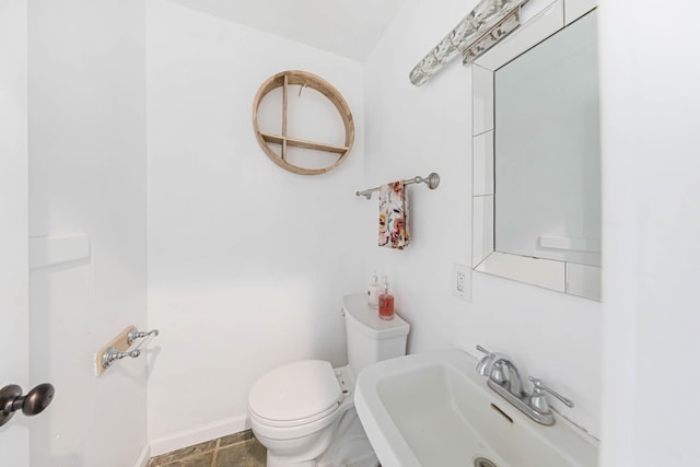 bathroom featuring sink and toilet