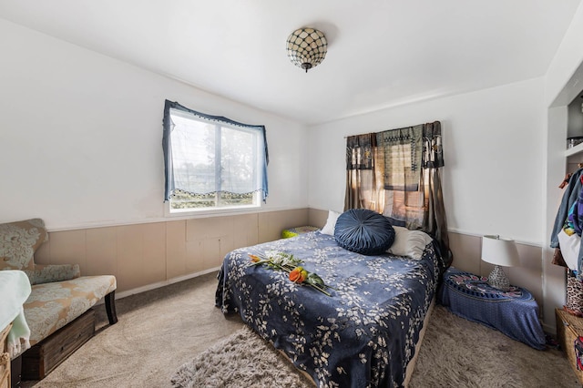 bedroom featuring light carpet