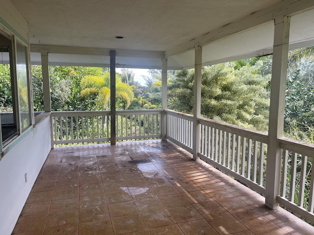 unfurnished sunroom with a wealth of natural light