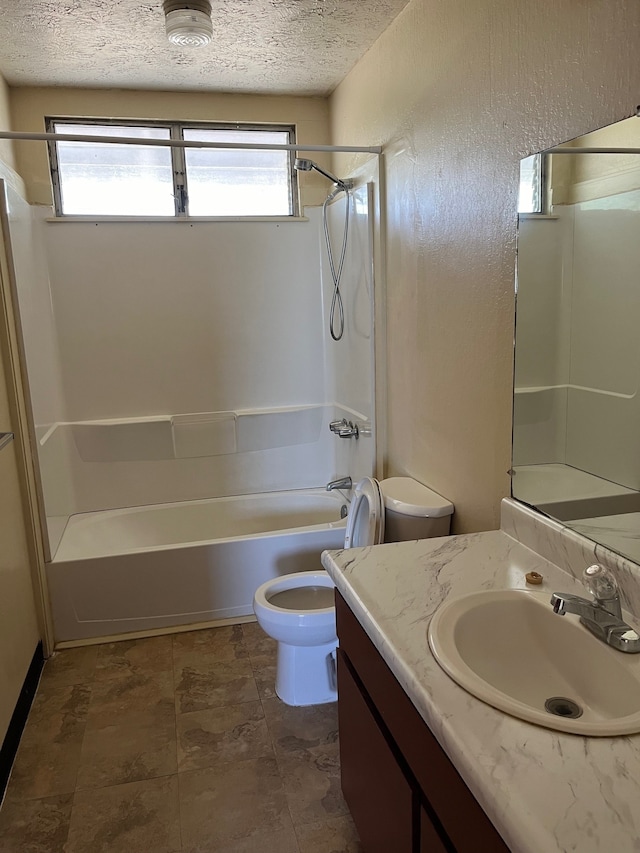 full bathroom with vanity, bathing tub / shower combination, a textured ceiling, and plenty of natural light