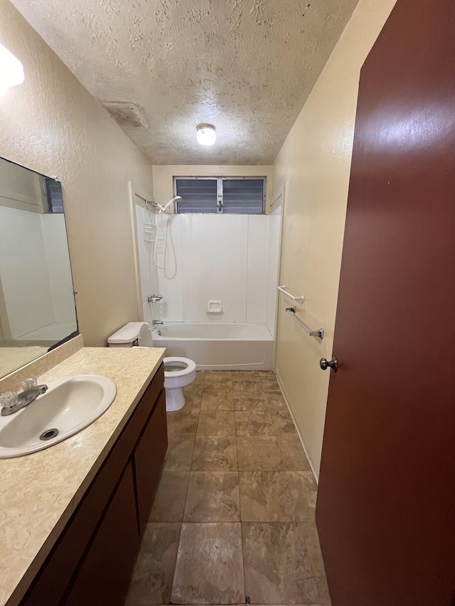 full bathroom with bathtub / shower combination, vanity, toilet, and a textured ceiling