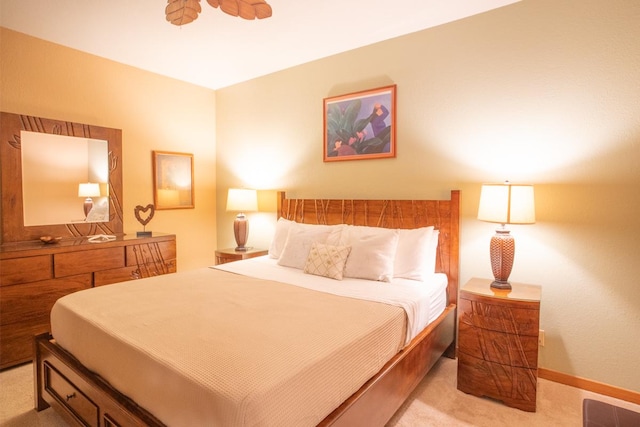 bedroom featuring light colored carpet