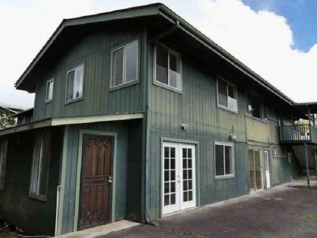 view of side of home featuring french doors