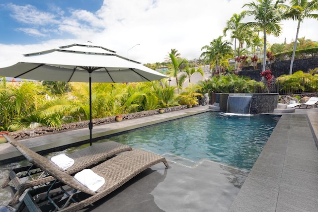 outdoor pool with a patio area