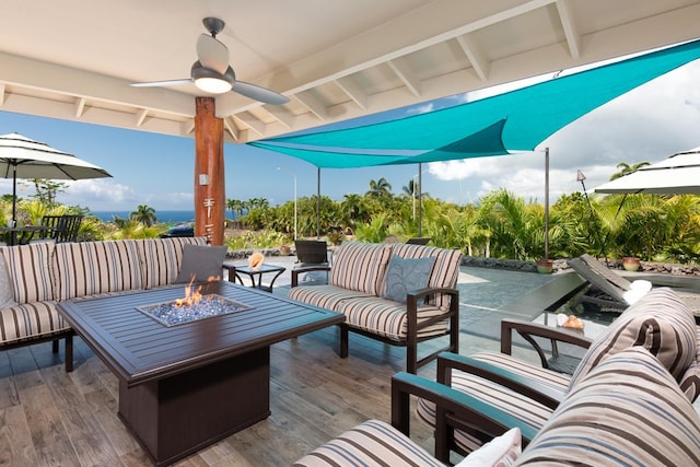 view of patio / terrace featuring an outdoor living space with a fire pit