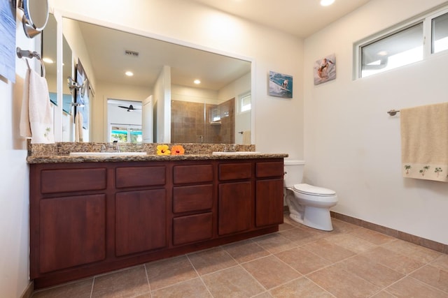 full bath with a healthy amount of sunlight, a shower stall, visible vents, and a sink