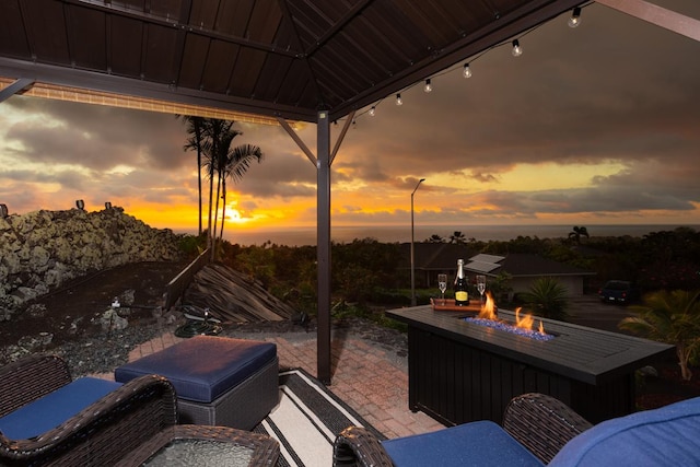 view of patio / terrace with an outdoor fire pit and a gazebo