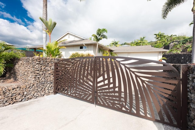 view of gate with fence