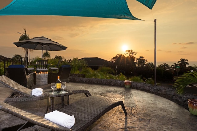 view of patio terrace at dusk