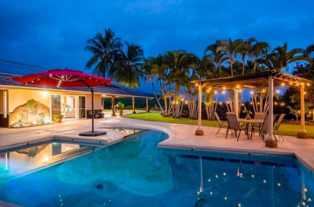 view of swimming pool with a patio and a pergola