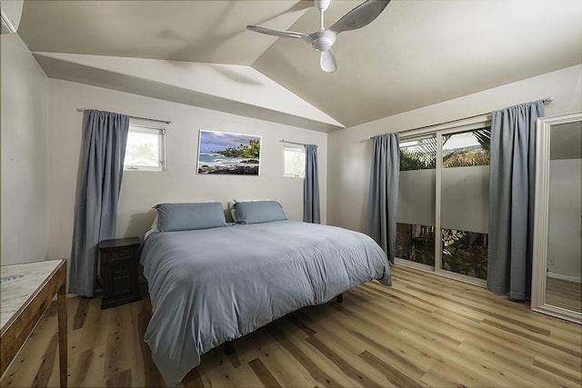 bedroom with vaulted ceiling, ceiling fan, and light hardwood / wood-style floors