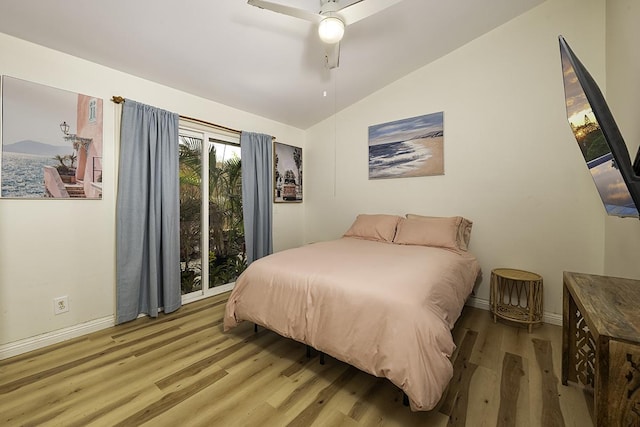 bedroom featuring lofted ceiling, hardwood / wood-style floors, and ceiling fan