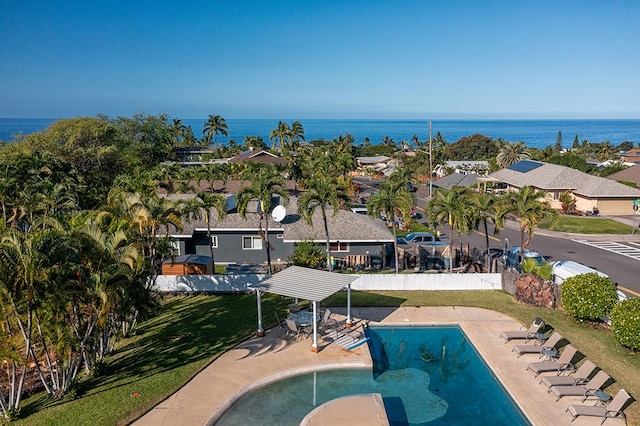 view of pool featuring a water view and a patio area