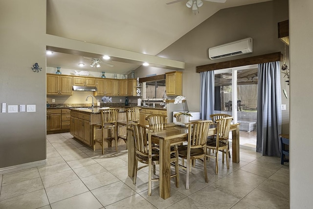 dining room with sink, ceiling fan, high vaulted ceiling, a wall unit AC, and light tile patterned flooring