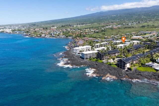 birds eye view of property with a water and mountain view