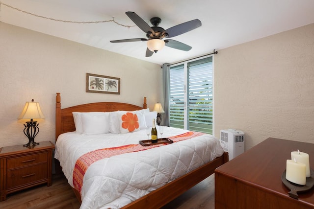 bedroom featuring ceiling fan and dark hardwood / wood-style flooring