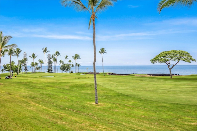 surrounding community featuring a yard, golf course view, and a water view