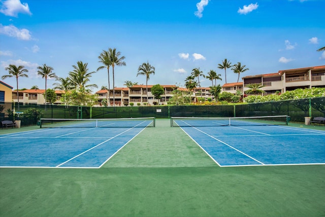 view of tennis court with fence