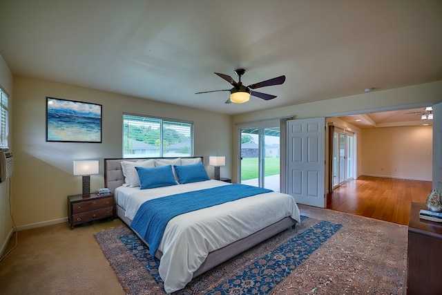 bedroom with access to outside and ceiling fan