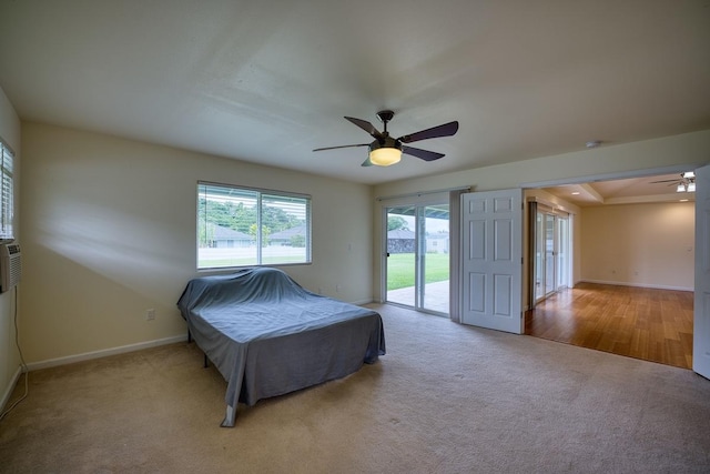 unfurnished bedroom with light carpet, access to exterior, and ceiling fan