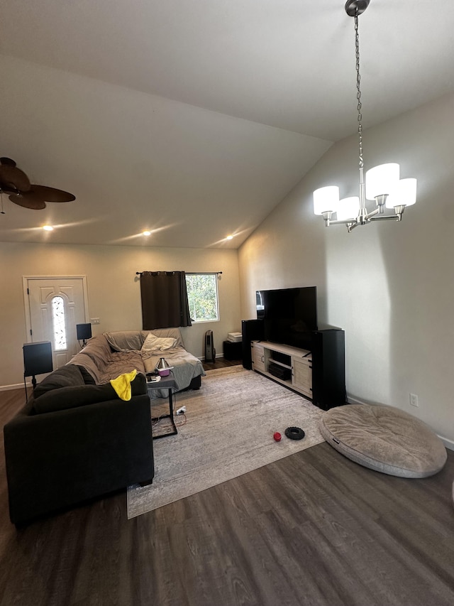 living room with hardwood / wood-style flooring, vaulted ceiling, and ceiling fan with notable chandelier