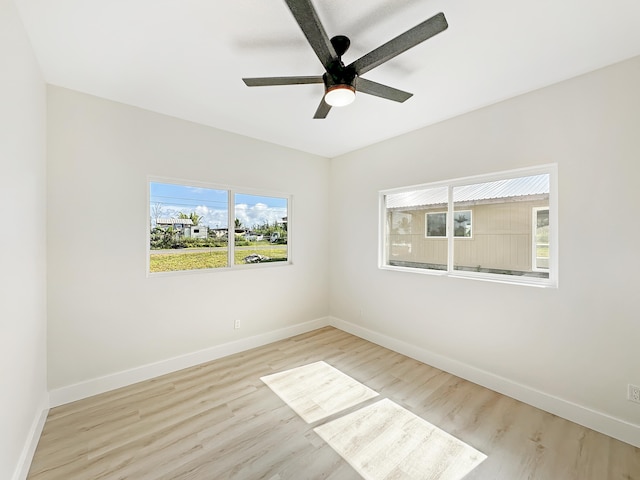 spare room with ceiling fan and light hardwood / wood-style floors