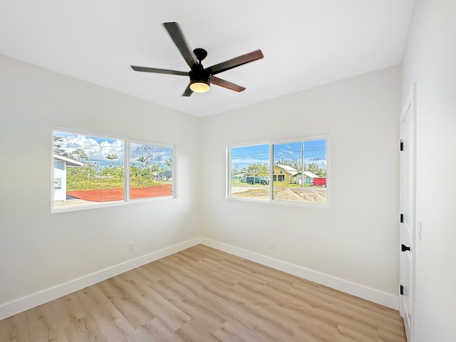 spare room with ceiling fan and light hardwood / wood-style flooring