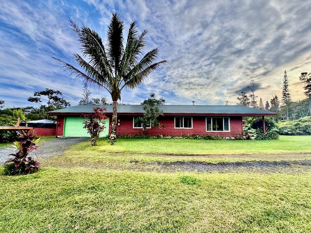 view of front of home with a garage and a front yard