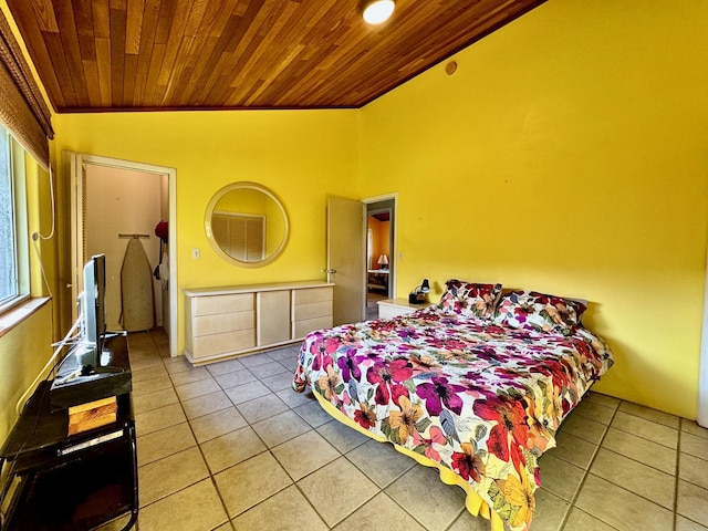 tiled bedroom featuring wood ceiling and vaulted ceiling