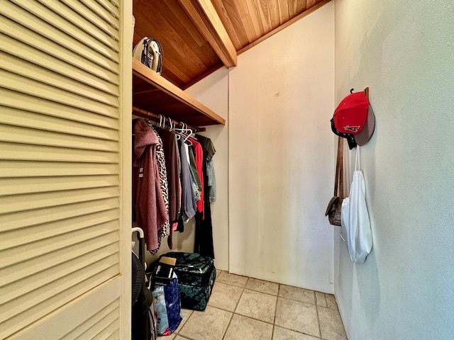 spacious closet with light tile patterned floors