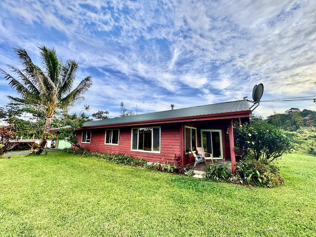 view of home's exterior featuring a lawn