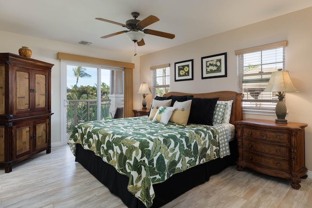 bedroom with access to exterior, ceiling fan, and light hardwood / wood-style flooring