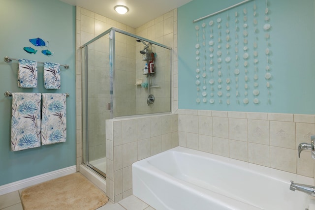 bathroom featuring separate shower and tub and tile patterned floors