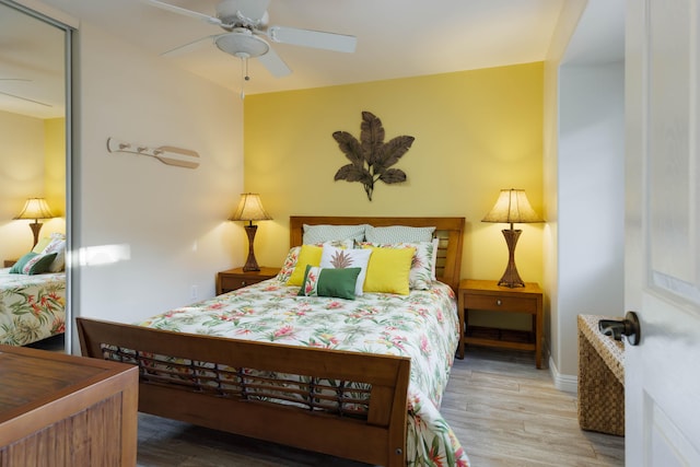 bedroom with ceiling fan and hardwood / wood-style floors