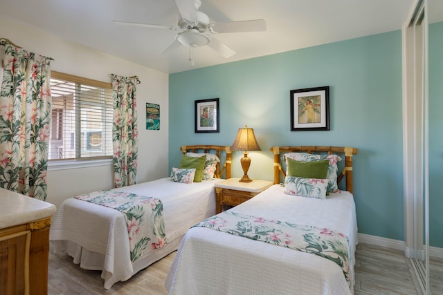 bedroom featuring ceiling fan and light hardwood / wood-style flooring