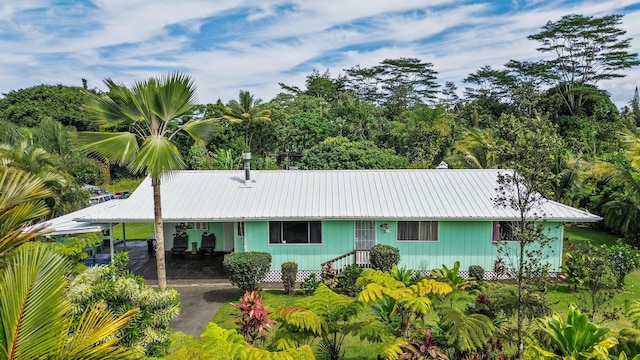 view of front facade with a carport