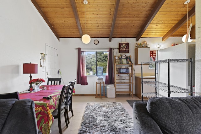 dining area featuring vaulted ceiling with beams and wooden ceiling