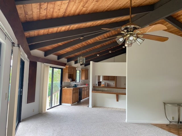 unfurnished living room featuring wood ceiling, light colored carpet, ceiling fan, and lofted ceiling with beams