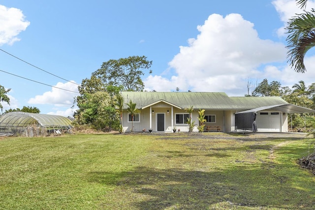 ranch-style home featuring a garage and a front lawn