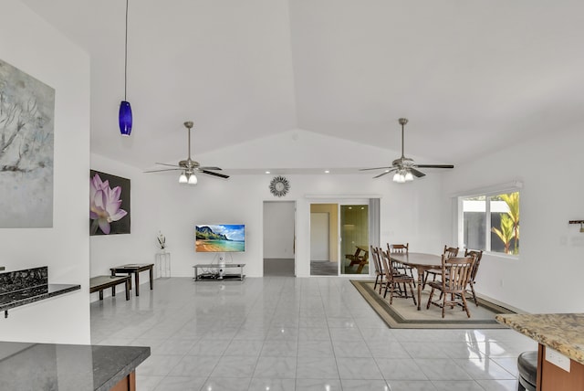 living room featuring vaulted ceiling and ceiling fan