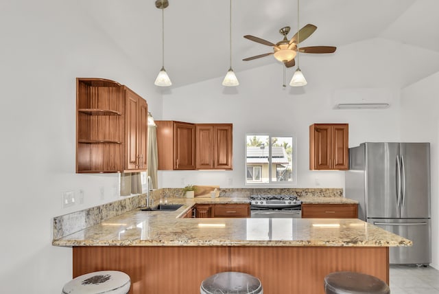 kitchen featuring a kitchen breakfast bar, stainless steel appliances, a wall mounted AC, vaulted ceiling, and kitchen peninsula