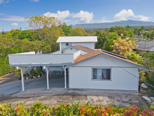 view of side of property featuring a mountain view