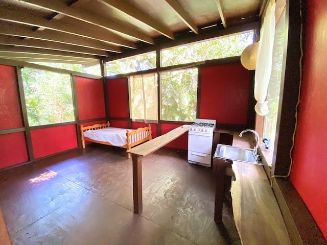 unfurnished sunroom featuring sink