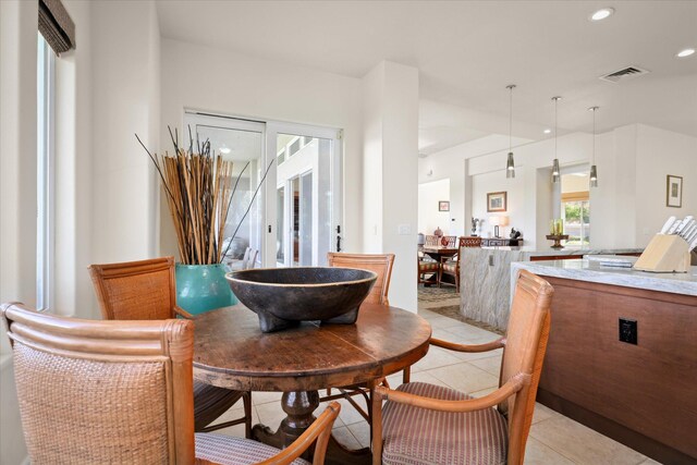 dining room featuring light tile patterned floors